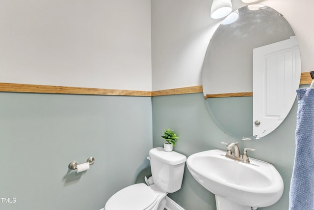 bathroom featuring sink and toilet