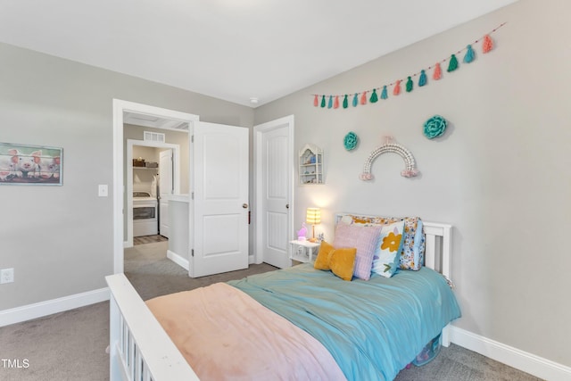 bedroom featuring carpet flooring and washer / dryer