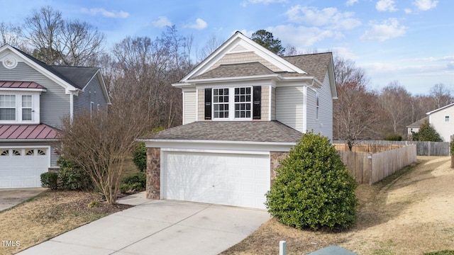 view of property exterior with roof with shingles, fence, a garage, stone siding, and driveway