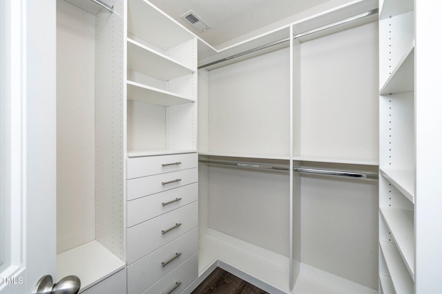 205 Spring Flower Ln, Durham, NC 27703 - spacious closet with visible vents and dark wood finished floors