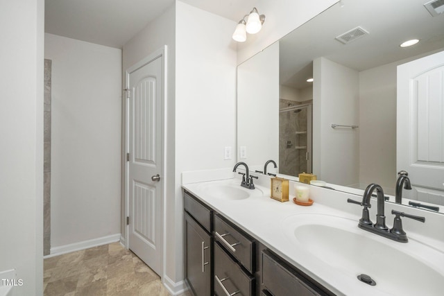 205 Spring Flower Ln, Durham, NC 27703 - full bath with a shower stall, double vanity, a sink, and visible vents