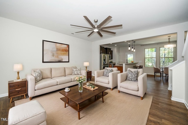 205 Spring Flower Ln, Durham, NC 27703 - living room featuring baseboards, ceiling fan, and dark wood finished floors