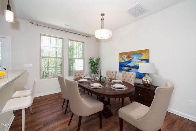 205 Spring Flower Ln, Durham, NC 27703 - dining space with wood finished floors, baseboards, and visible vents