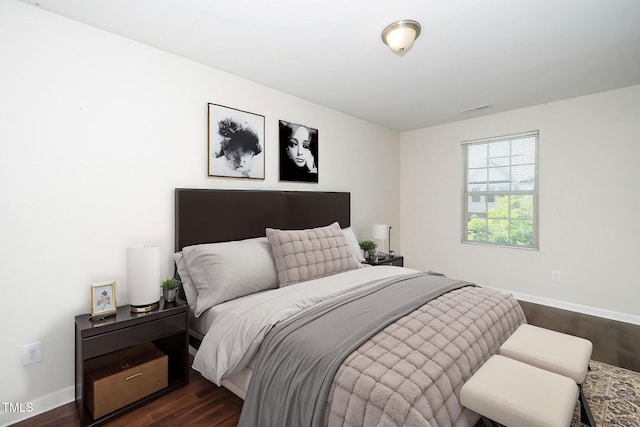 205 Spring Flower Ln, Durham, NC 27703 - bedroom featuring dark wood-style flooring, baseboards, and visible vents