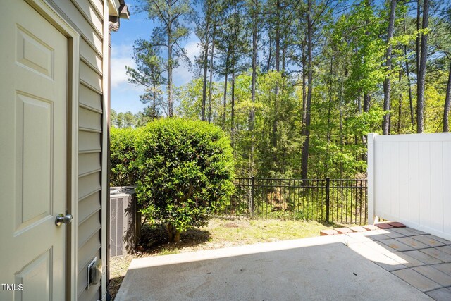 205 Spring Flower Ln, Durham, NC 27703 - view of patio / terrace featuring central AC and fence