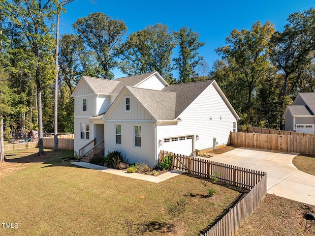 view of front of home featuring a garage and a front yard