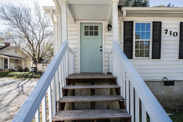 view of exterior entry with crawl space