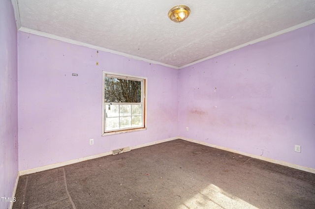 unfurnished room featuring a textured ceiling and crown molding