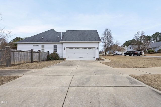 view of side of property with a garage