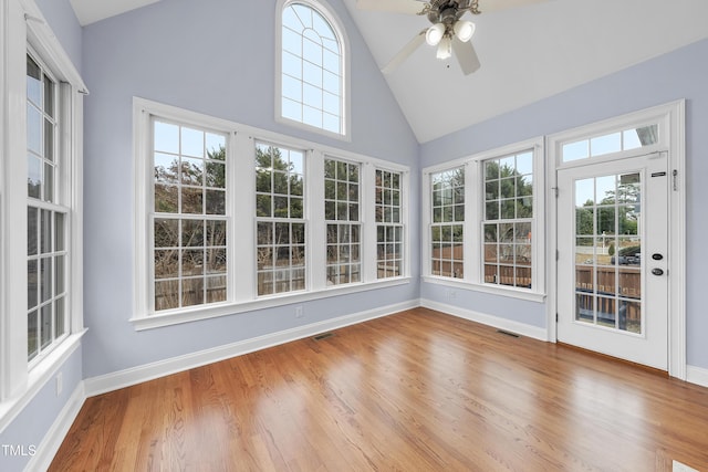 unfurnished sunroom featuring ceiling fan and lofted ceiling