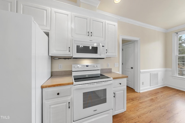 kitchen featuring ornamental molding, white cabinets, white appliances, and light hardwood / wood-style floors