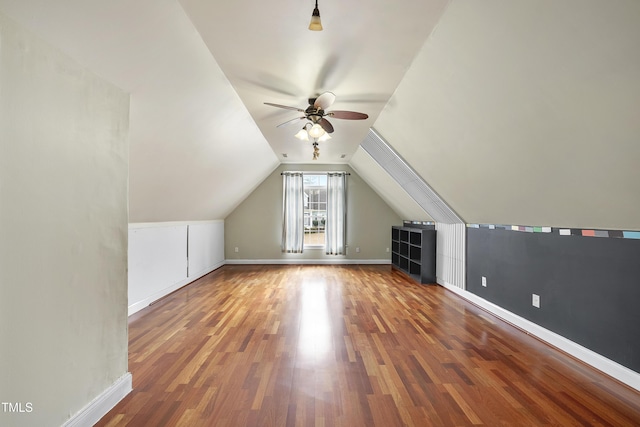 bonus room featuring lofted ceiling, dark wood-type flooring, and ceiling fan