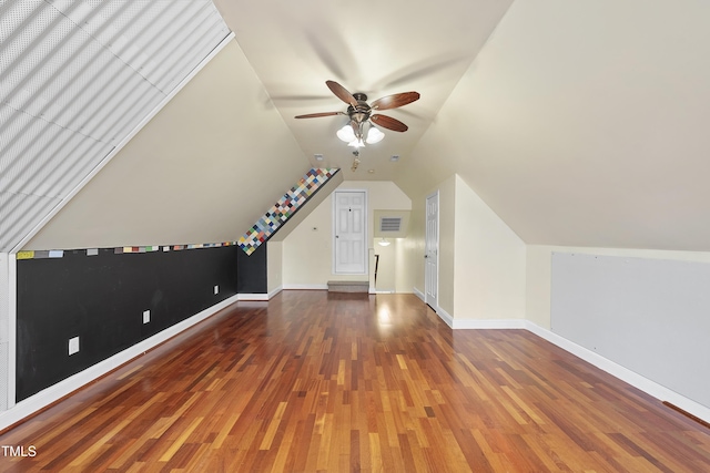 bonus room featuring lofted ceiling, dark wood-type flooring, and ceiling fan