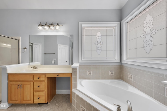 bathroom with tile patterned flooring, vanity, and shower with separate bathtub