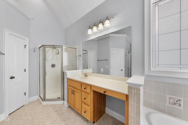 bathroom featuring lofted ceiling, vanity, tile patterned flooring, and independent shower and bath