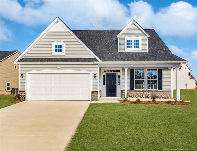 craftsman inspired home with a garage and a front yard