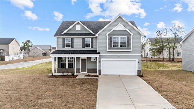 view of front facade with a garage and a front lawn