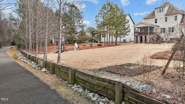 view of yard featuring a sunroom