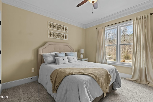 bedroom featuring crown molding, ceiling fan, and carpet floors