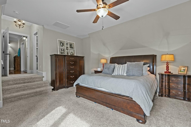 carpeted bedroom featuring ornamental molding and ceiling fan