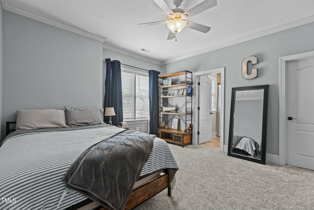 carpeted bedroom featuring ceiling fan and ornamental molding