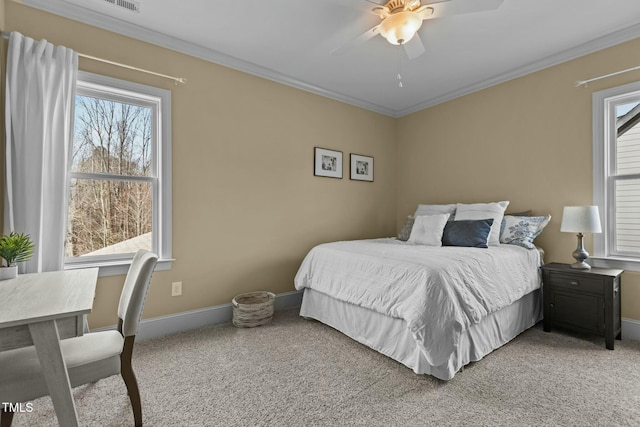 bedroom featuring crown molding, carpet flooring, and ceiling fan