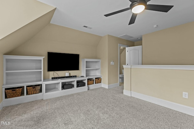 unfurnished living room featuring vaulted ceiling, light colored carpet, and ceiling fan