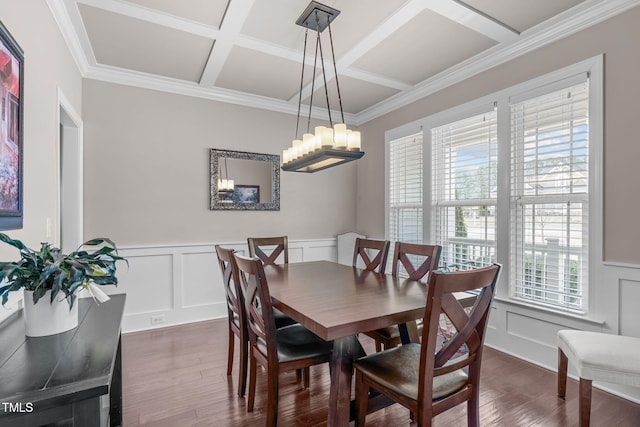 dining space with coffered ceiling, dark wood-style flooring, crown molding, a decorative wall, and a notable chandelier