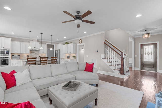 living area with recessed lighting, dark wood-type flooring, baseboards, stairs, and crown molding