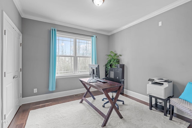 office space featuring baseboards, wood finished floors, and ornamental molding