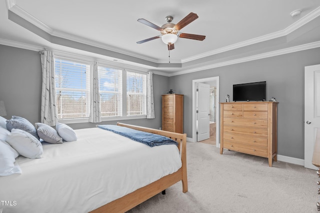 bedroom featuring light carpet, baseboards, a raised ceiling, and crown molding