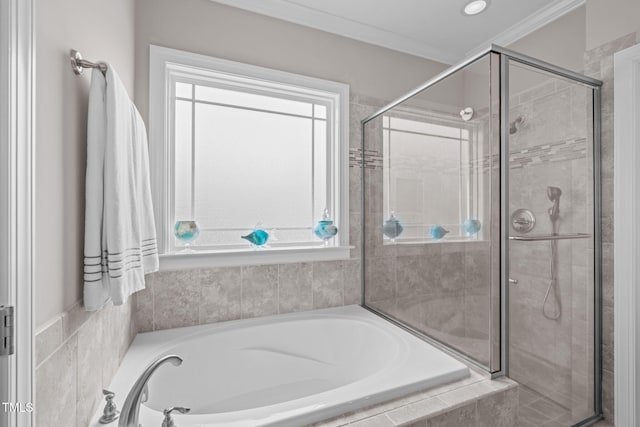 bathroom featuring crown molding, a stall shower, a garden tub, and plenty of natural light