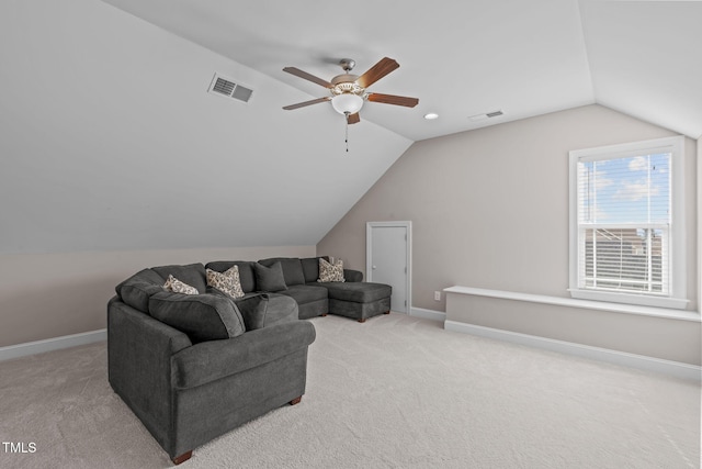 living room featuring light colored carpet, visible vents, and baseboards