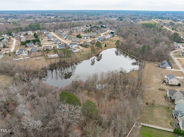 drone / aerial view featuring a water view and a residential view