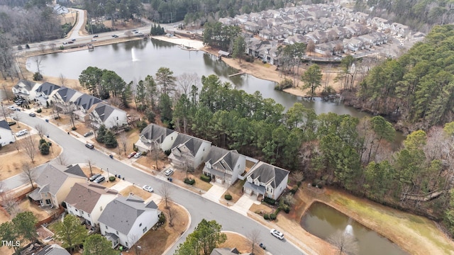 drone / aerial view featuring a residential view and a water view