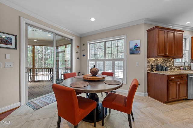 dining room featuring recessed lighting, baseboards, and ornamental molding