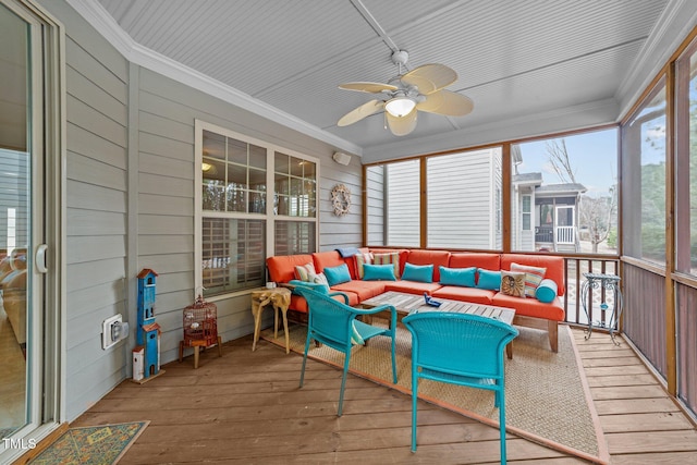 sunroom / solarium with a ceiling fan