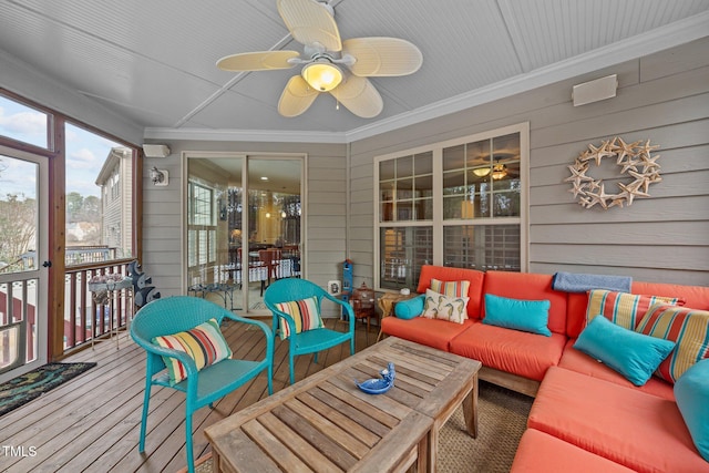 sunroom / solarium featuring ceiling fan