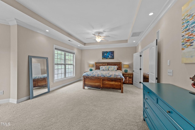 bedroom with visible vents, baseboards, a tray ceiling, ornamental molding, and light colored carpet