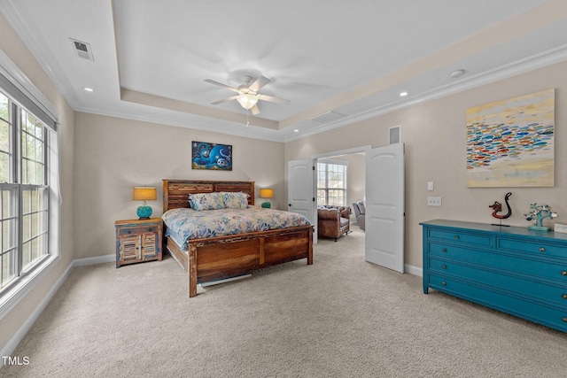 bedroom with baseboards, a raised ceiling, carpet floors, and ornamental molding