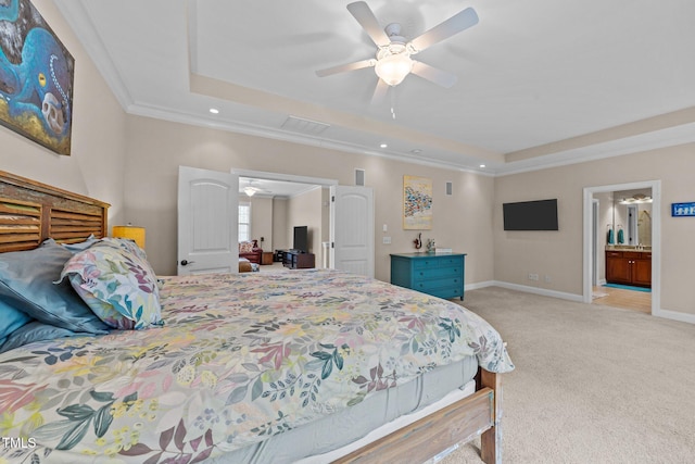 bedroom featuring visible vents, baseboards, ornamental molding, light carpet, and a raised ceiling