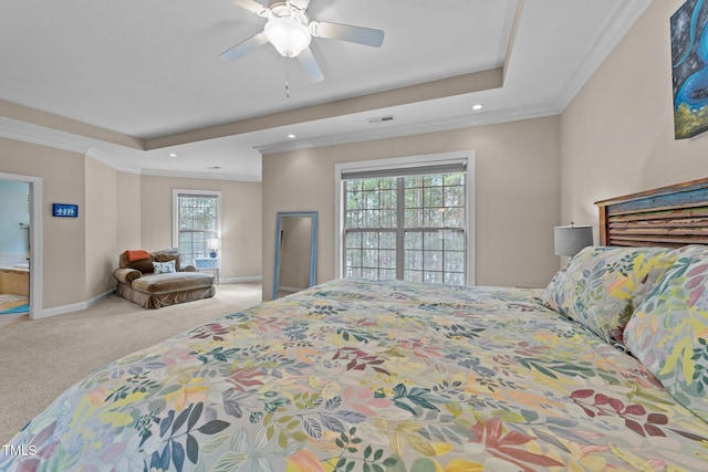 bedroom featuring visible vents, baseboards, a tray ceiling, and carpet