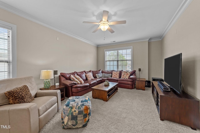 living area featuring visible vents, carpet floors, ornamental molding, and a ceiling fan