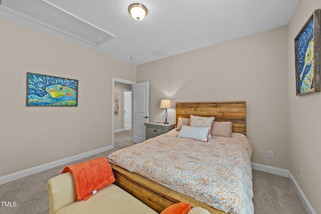 bedroom with attic access, baseboards, and carpet floors