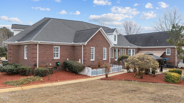 view of home's exterior with a patio area and a lawn