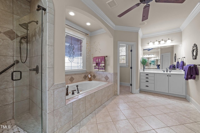 bathroom with tile patterned floors, vanity, crown molding, and separate shower and tub