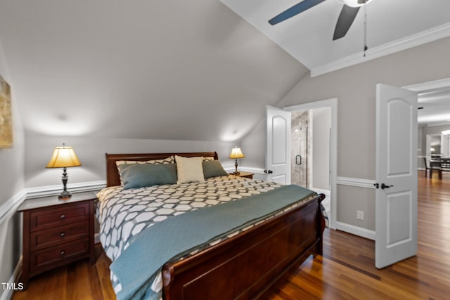 bedroom featuring ceiling fan, dark wood-type flooring, ornamental molding, and vaulted ceiling