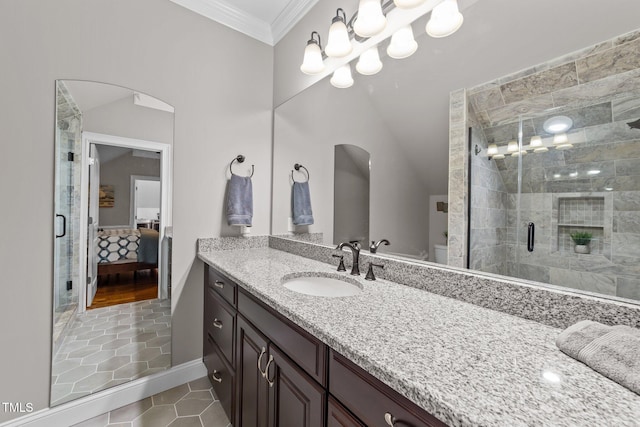 bathroom with vanity, crown molding, a shower with door, and tile patterned flooring