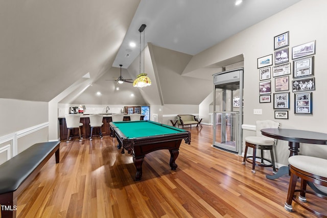 rec room with sink, light wood-type flooring, vaulted ceiling, and billiards