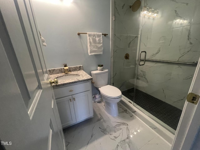 bathroom with a shower with door, toilet, and vanity